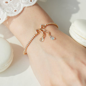 ALICE｜Blue Topaz & Pearl Gold Bow Tennis Bracelet